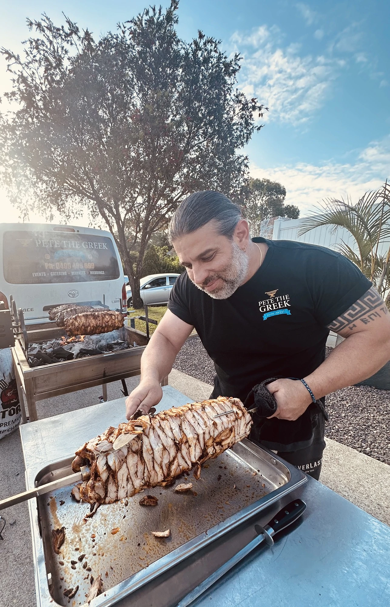 Traditional Greek catering spread with moussaka, souvlaki, gyros, spanakopita, and tzatziki, perfect for weddings and corporate functions or any event.